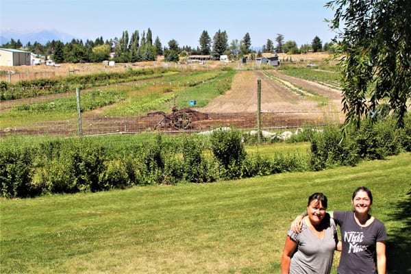 Saunders Family Farm co-owner Faith Saunders and sales manager Rae McPherson, on site at the farm’s u-pick operations in Windermere, are proving coffee isn’t the Columbia Valley’s only big success story — Saunders jams and jellies were picked up by Safeway in June with more growth on the horizon for this family-run business. Photo by Nicole Trigg